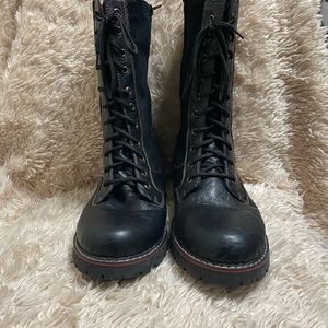 Very trendy black leather boots with treaded rubber soles.